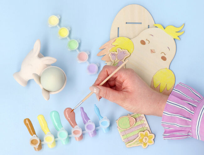 person painting bird cutout